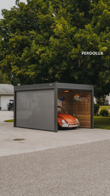 Modern carport with a car inside, branded 'PERGOLUX', surrounded by trees.