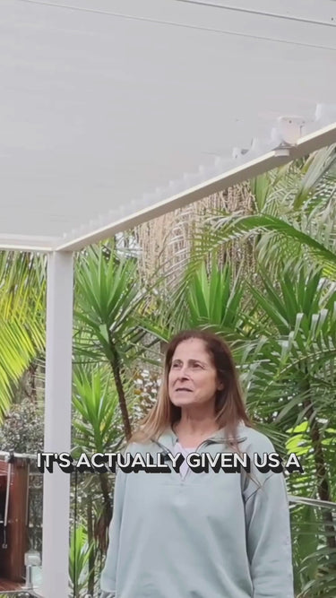 Woman explaining the benefits of a Pergolux Pergola