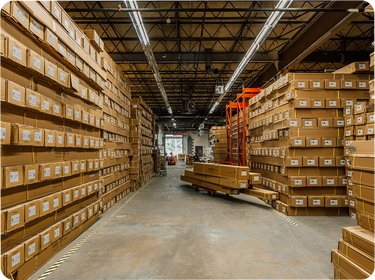 Pergolux Warehouse with stacked cardboard boxes on pallets