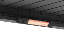 Anthracite grey PERGOLUX outdoor heater installed flush in pergola beam showing red infrared glow