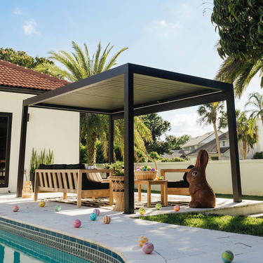 Patio with pergola, outdoor furniture, and pool area on a sunny day.