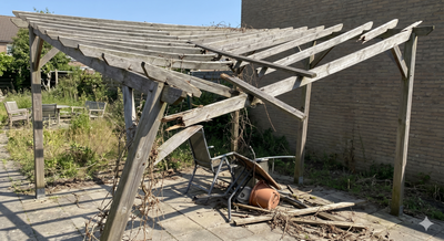 Worn wooden pergola with collapsing roof structure on a patio area.