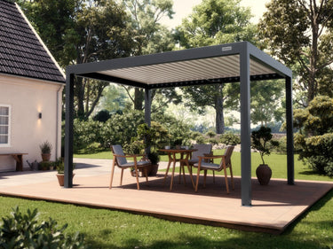 Dark grey matte aluminium pergola frame with closed white louvered roof and string lights over deck dining