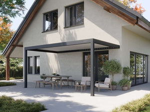 dark frame attached pergola covering wooden bench seating and upholstered armchairs on stone deck