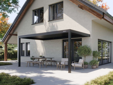 Matte black aluminum pergola with closed louvres and PERGOLUX logo