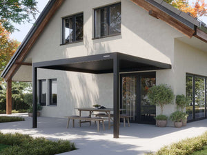 Charcoal freestanding pergola with horizontal louvre blades on grey paving