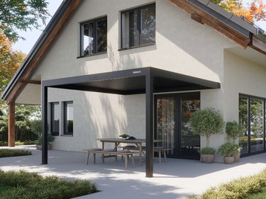 Charcoal freestanding pergola with horizontal louvre blades on grey paving