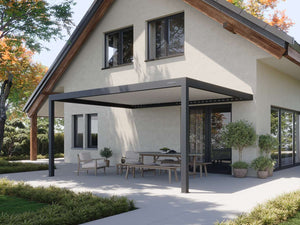 black wall-mounted pergola extending from modern home exterior shading wooden dining set