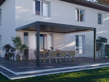 Fixed beam dark grey pergola with solid slatted ceiling and glowing LED lights