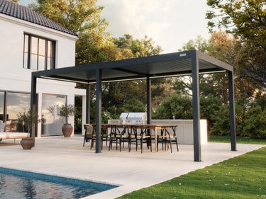 Wide shot of charcoal pergola with fully closed horizontal slat roofing over outdoor kitchen area