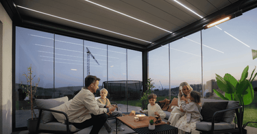 Close up of parallel linear LED light strips and infrared heater inside PERGOLUX pergola roof over outdoor sofas