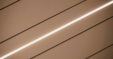 Close-up of beige aluminium louvres on Pergola 4 Pro Max showing powder coated texture and LED strip