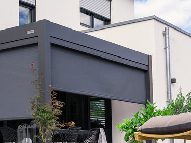 dark grey fabric roller screen retracted into housing box